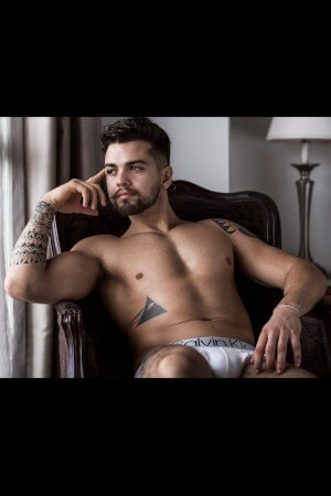 live drawing model wearing just his undies and posing for a group of hens near auckland's kingsland