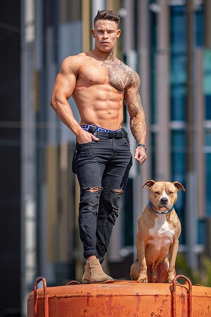 bad boy male stripper in jeans and showing off awesome torso in auckland's cbd