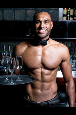 Topless Waiter at Work black topless waiter serving a tray of drinks